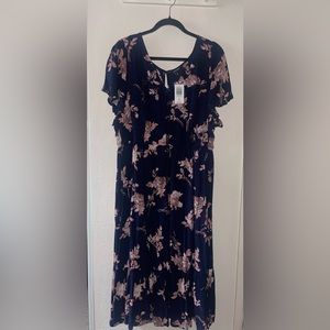 Mid calf length blue floral dress. Has pockets